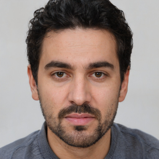 Neutral white young-adult male with short  black hair and brown eyes