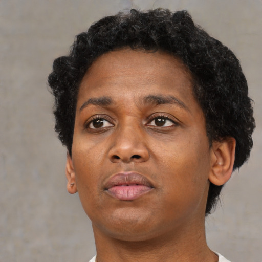 Neutral black young-adult female with short  brown hair and brown eyes