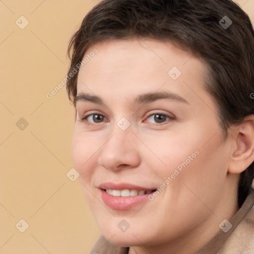 Joyful white young-adult female with short  brown hair and brown eyes