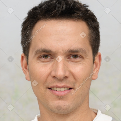 Joyful white adult male with short  brown hair and brown eyes