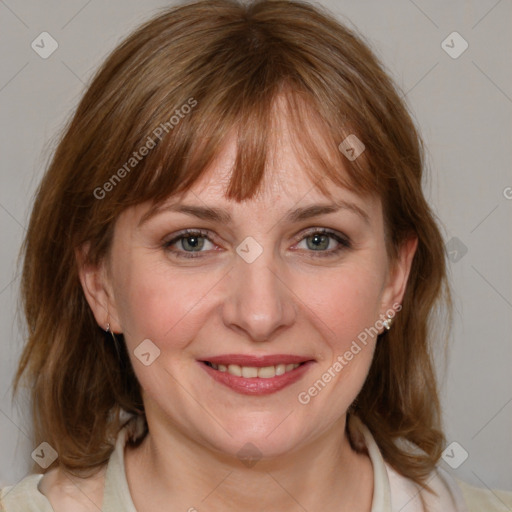 Joyful white adult female with medium  brown hair and blue eyes