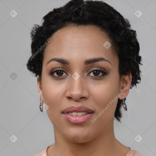 Joyful black young-adult female with short  black hair and brown eyes