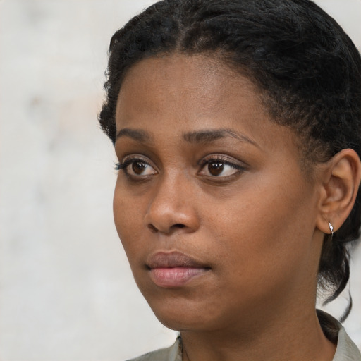 Neutral black young-adult female with short  black hair and brown eyes