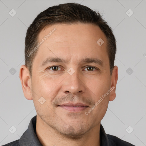 Joyful white adult male with short  brown hair and brown eyes