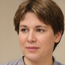 Joyful white adult female with medium  brown hair and brown eyes