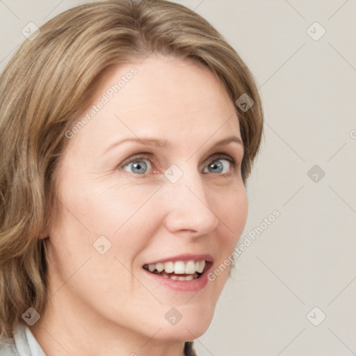 Joyful white young-adult female with medium  brown hair and blue eyes