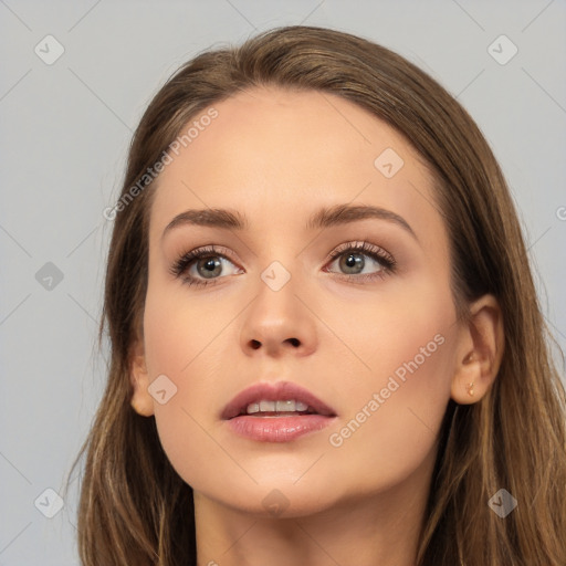 Neutral white young-adult female with long  brown hair and brown eyes