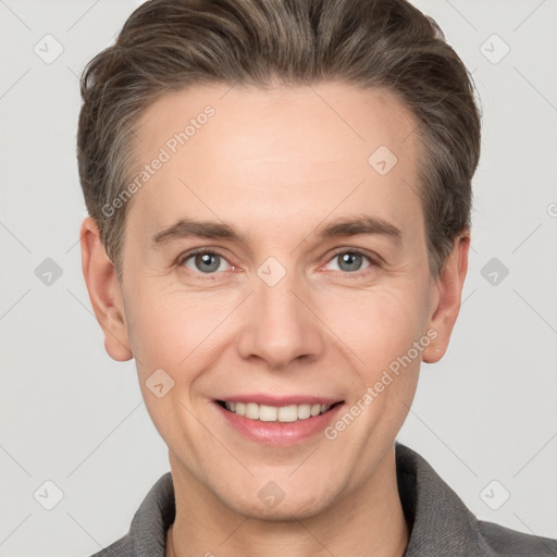 Joyful white adult male with short  brown hair and grey eyes