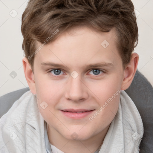 Joyful white child male with short  brown hair and grey eyes