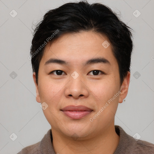 Joyful asian young-adult male with short  brown hair and brown eyes