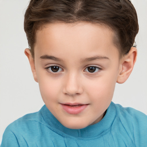 Joyful white child female with short  brown hair and brown eyes