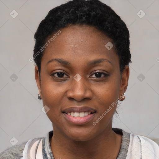 Joyful black young-adult female with short  black hair and brown eyes