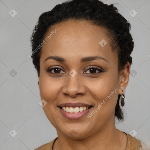 Joyful latino young-adult female with short  brown hair and brown eyes