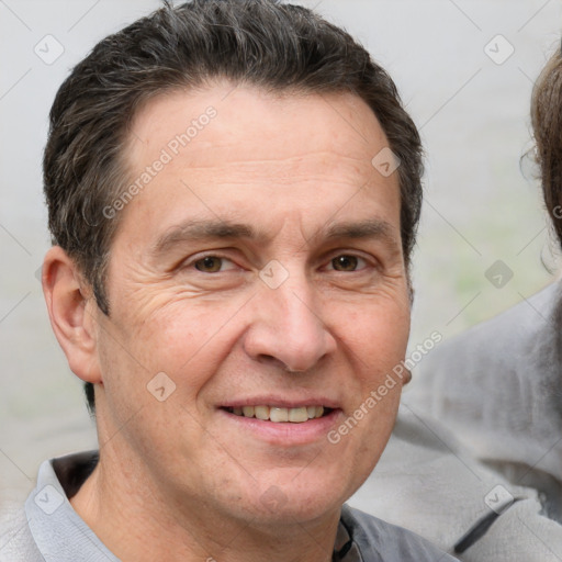 Joyful white adult male with short  brown hair and brown eyes