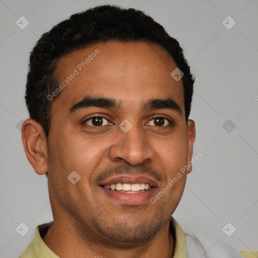 Joyful latino young-adult male with short  black hair and brown eyes