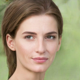 Joyful white young-adult female with medium  brown hair and green eyes