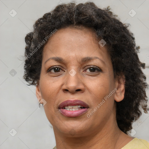 Joyful black adult female with short  brown hair and brown eyes