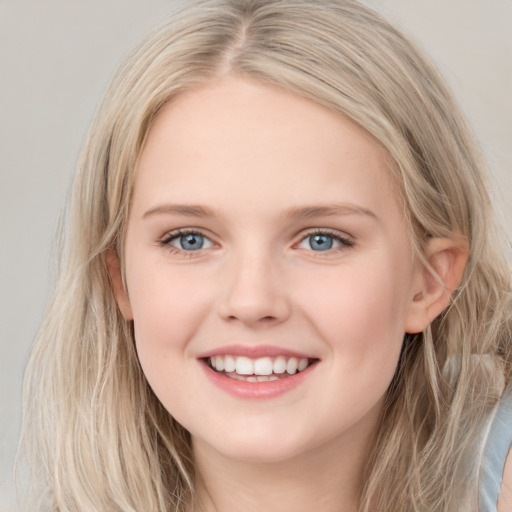 Joyful white young-adult female with long  brown hair and blue eyes