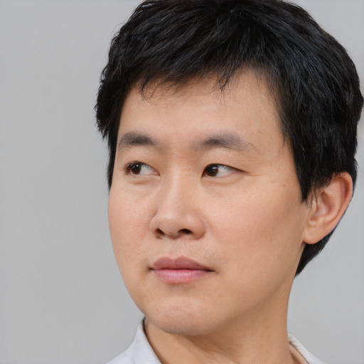 Neutral asian young-adult male with short  black hair and brown eyes