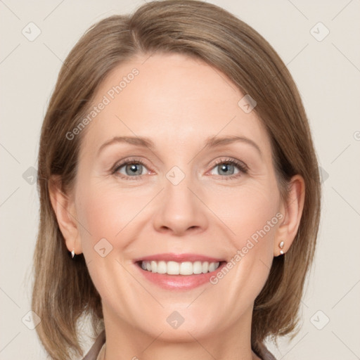 Joyful white adult female with medium  brown hair and grey eyes