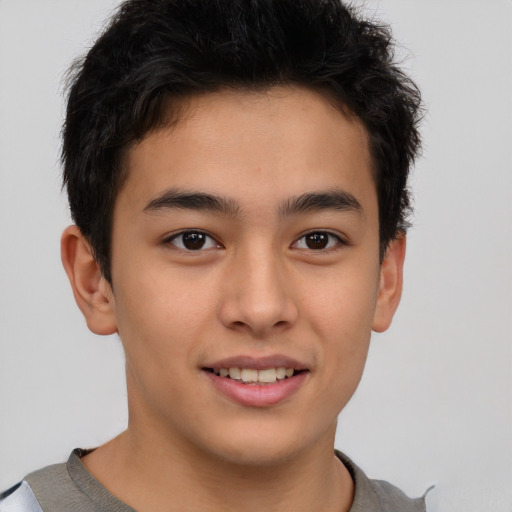 Joyful asian young-adult male with short  brown hair and brown eyes