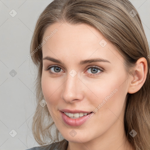 Joyful white young-adult female with long  brown hair and grey eyes