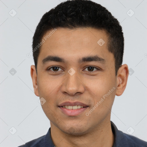 Joyful white young-adult male with short  black hair and brown eyes