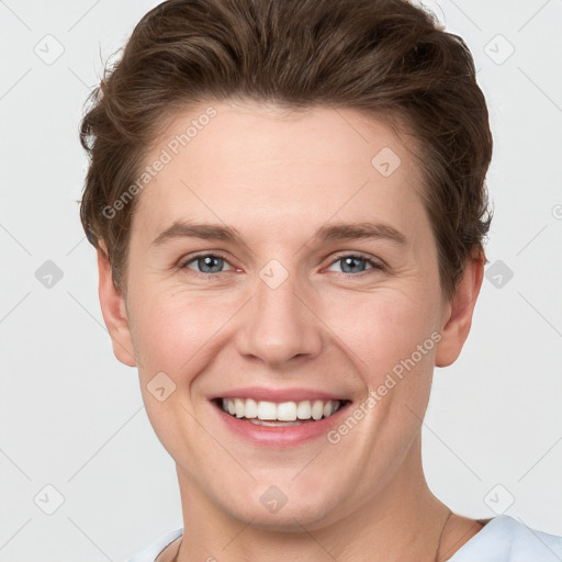 Joyful white young-adult female with short  brown hair and grey eyes