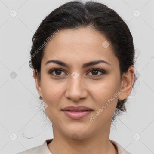 Joyful latino young-adult female with medium  brown hair and brown eyes