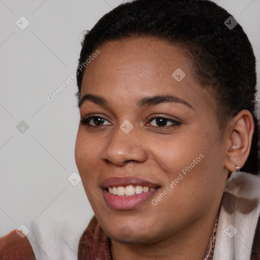 Joyful black young-adult female with short  brown hair and brown eyes