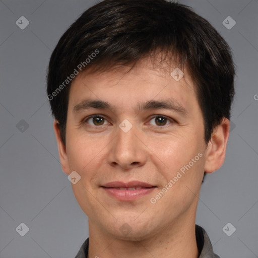 Joyful white adult male with short  brown hair and brown eyes