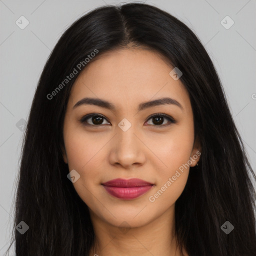 Joyful latino young-adult female with long  black hair and brown eyes