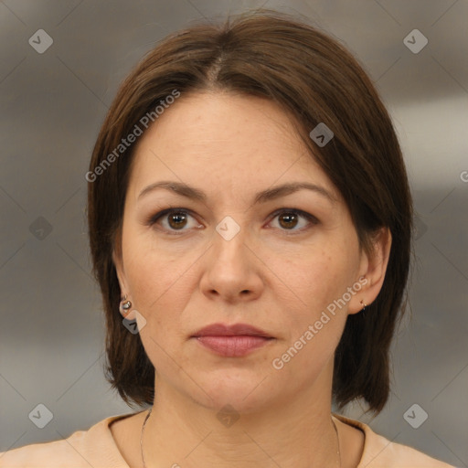 Joyful white adult female with medium  brown hair and brown eyes