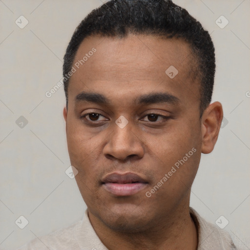Neutral latino young-adult male with short  black hair and brown eyes