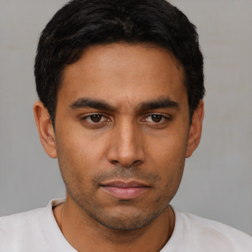 Neutral latino young-adult male with short  brown hair and brown eyes