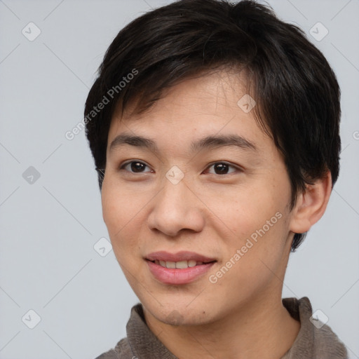 Joyful asian young-adult male with short  brown hair and brown eyes