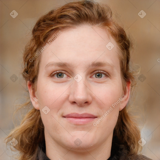 Joyful white young-adult female with medium  brown hair and blue eyes