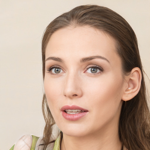 Neutral white young-adult female with long  brown hair and green eyes