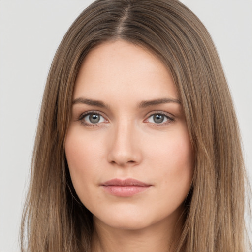 Neutral white young-adult female with long  brown hair and brown eyes