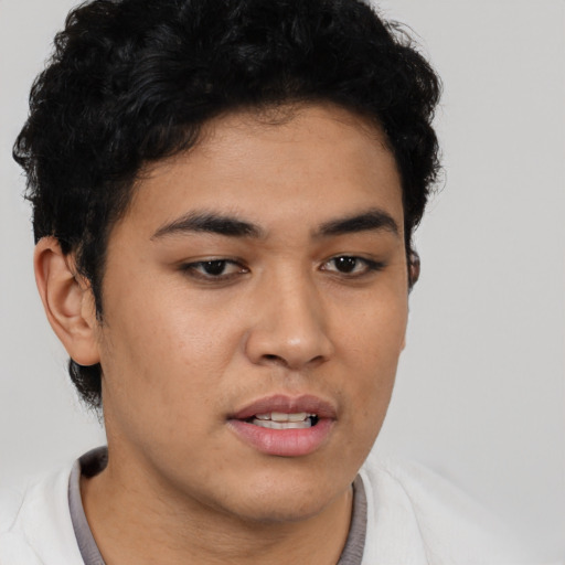 Neutral latino young-adult male with short  brown hair and brown eyes