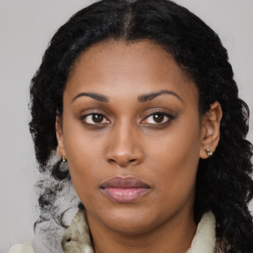 Neutral black young-adult female with long  black hair and brown eyes