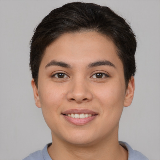 Joyful asian young-adult female with short  brown hair and brown eyes
