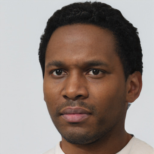 Neutral black young-adult male with short  black hair and brown eyes