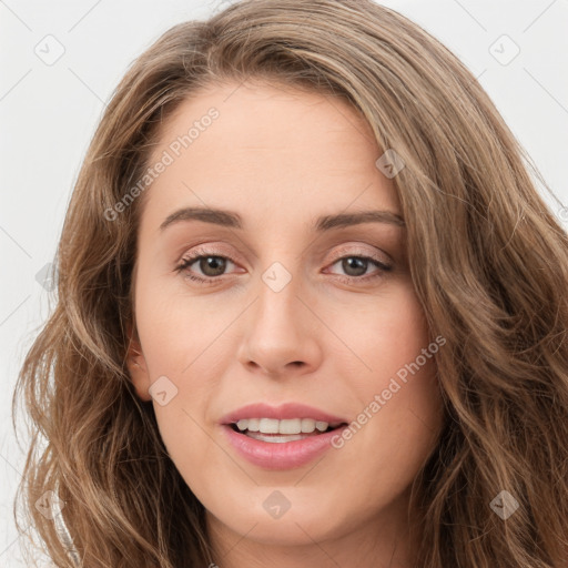 Joyful white young-adult female with long  brown hair and green eyes