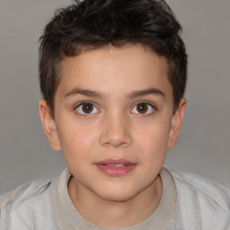 Joyful white child male with short  brown hair and brown eyes