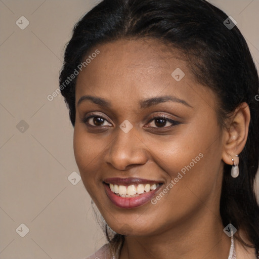 Joyful latino young-adult female with long  brown hair and brown eyes