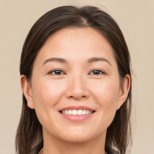 Joyful white young-adult female with medium  brown hair and brown eyes