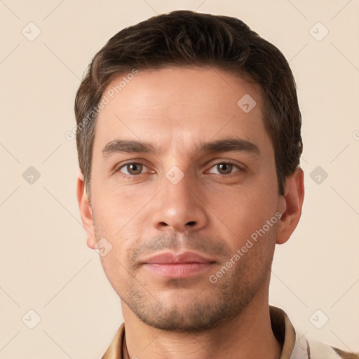 Neutral white young-adult male with short  brown hair and brown eyes