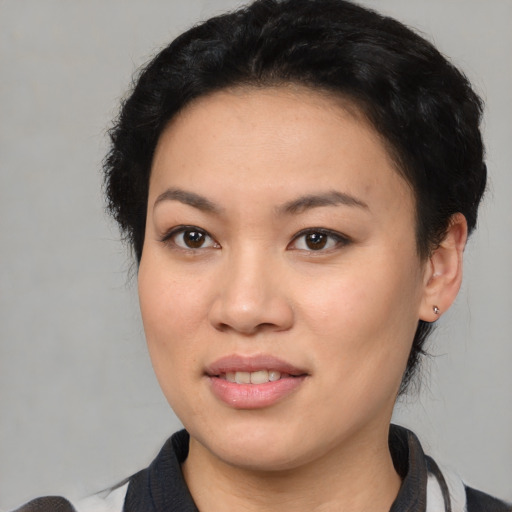 Joyful white young-adult female with short  black hair and brown eyes