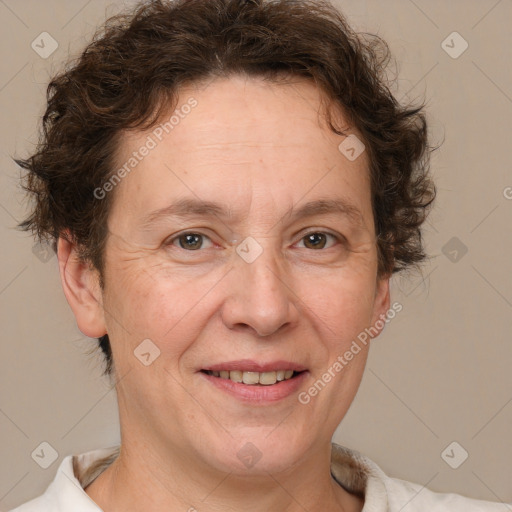 Joyful white adult female with short  brown hair and brown eyes